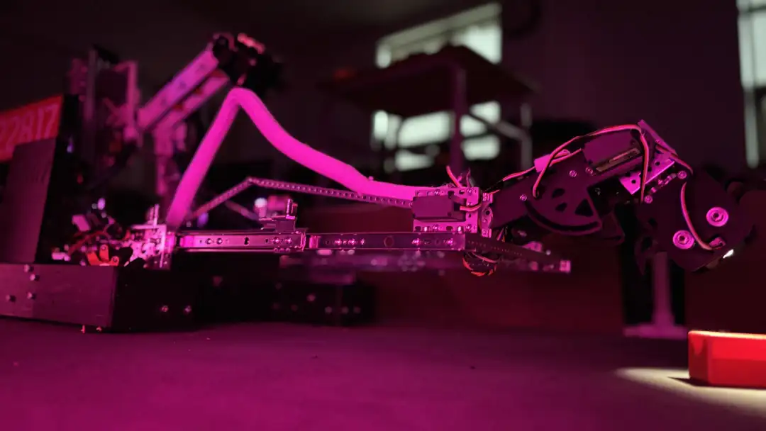 Photo of our robot grabbing a sample